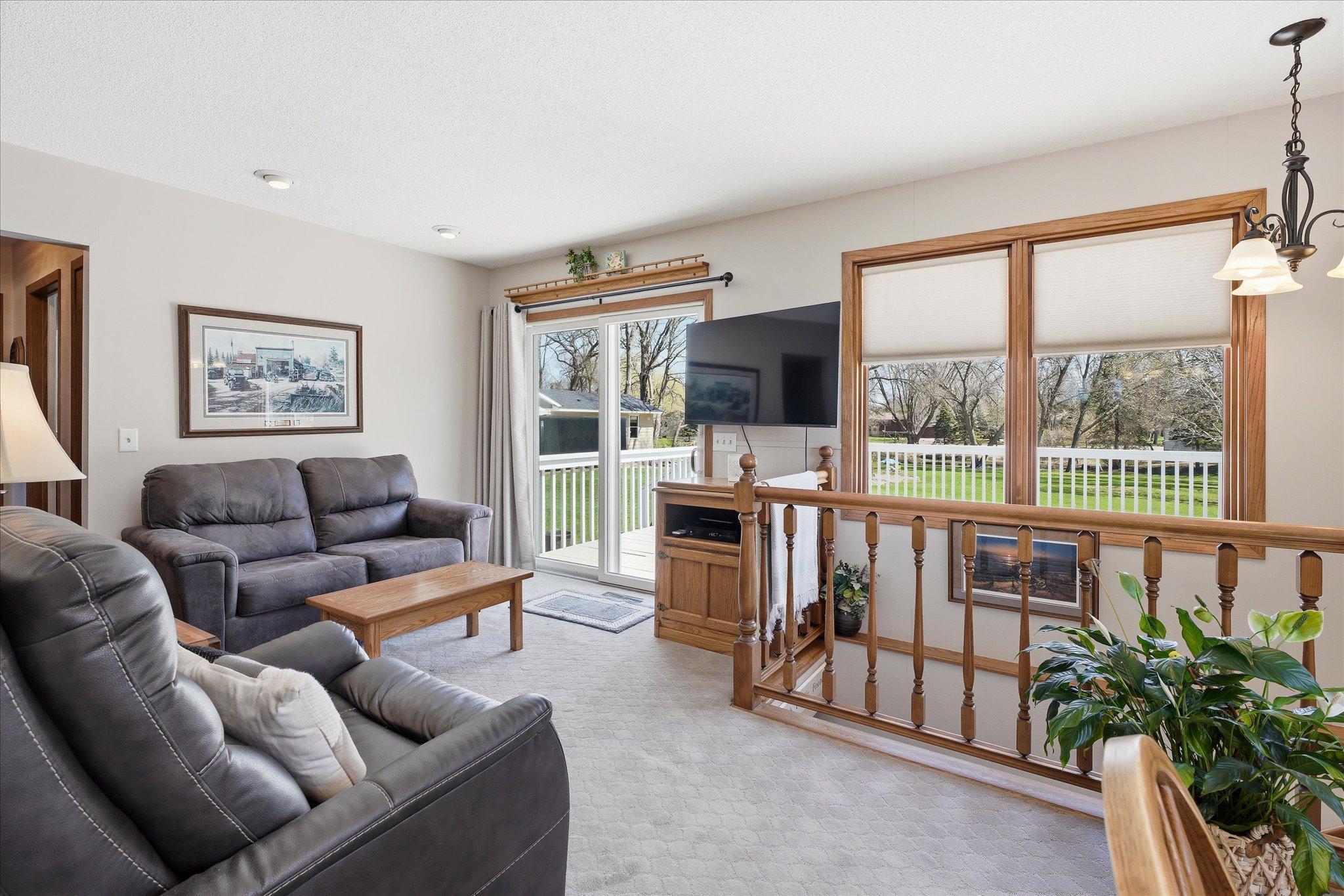 The cozy family room leads out to the massive deck and backyard.