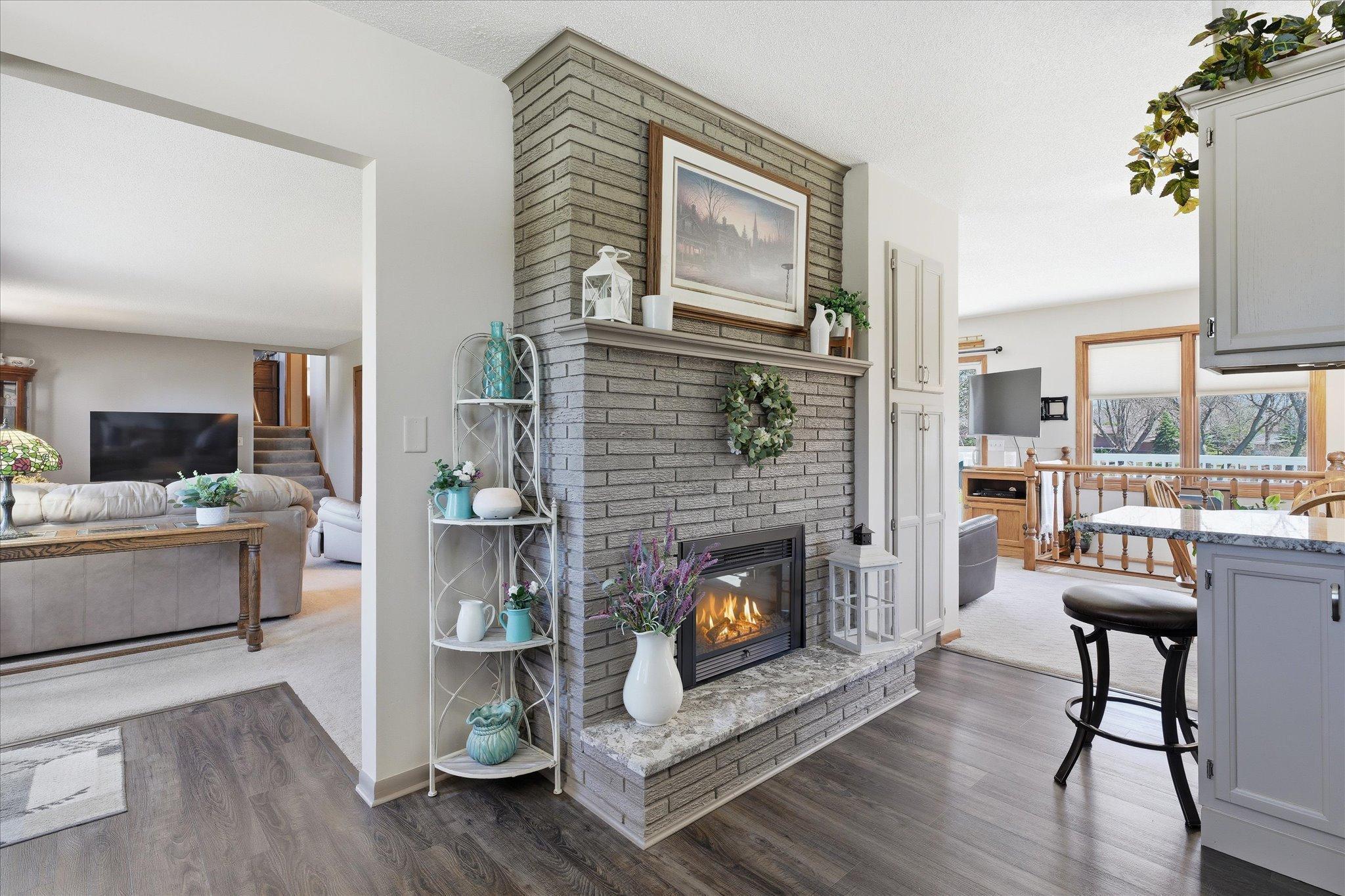 Simply stunning electric fireplace in the kitchen area!
