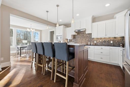 So much natural light flows into the gourmet kitchen. Wonderful tiered center island