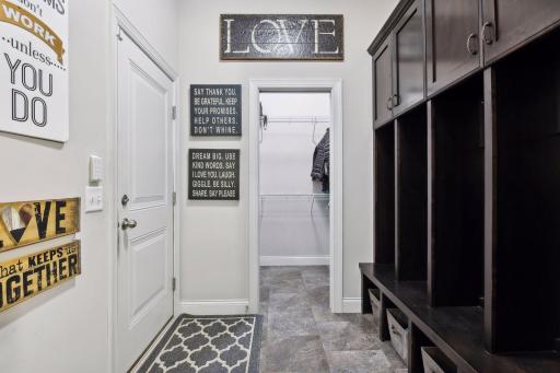 Custom locker units and large closet in the mudroom