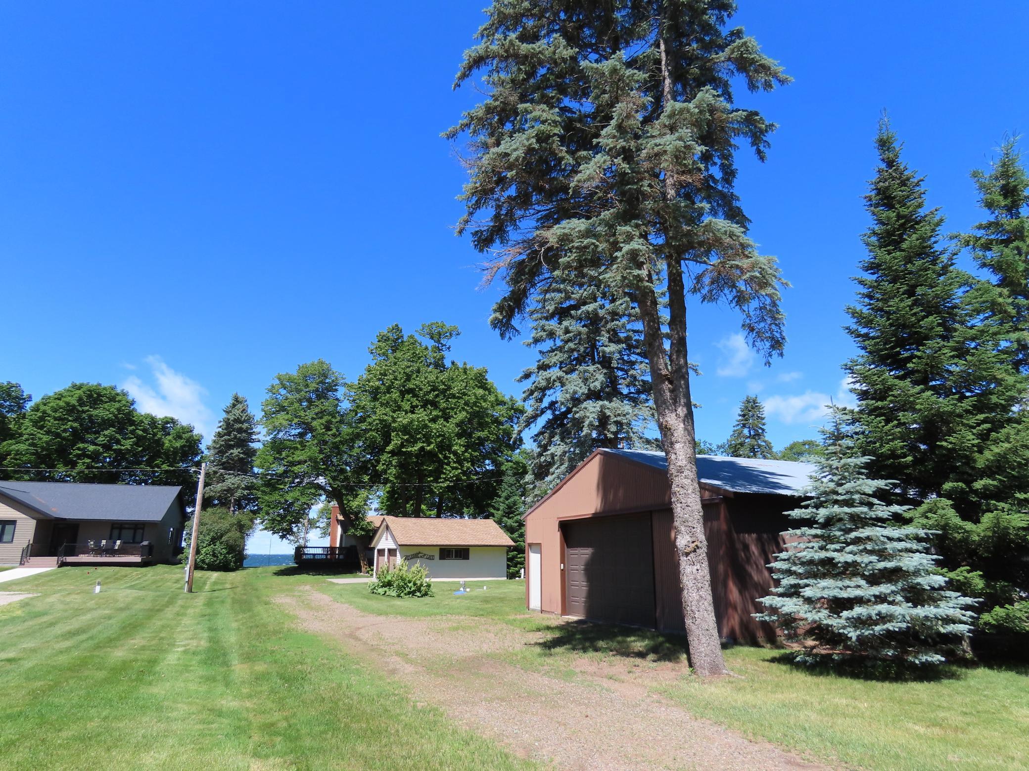 Deep lot with 2 car garage and a pole barn