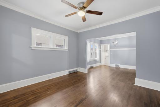 View from the front door of the living room and dining room towards the kitchen entry.