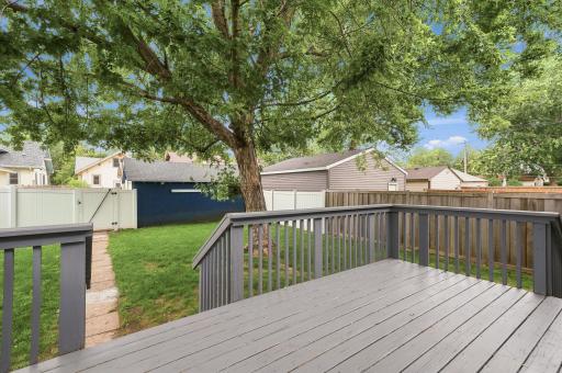 Access the deck through the kitchen to enjoy the fully fenced backyard.