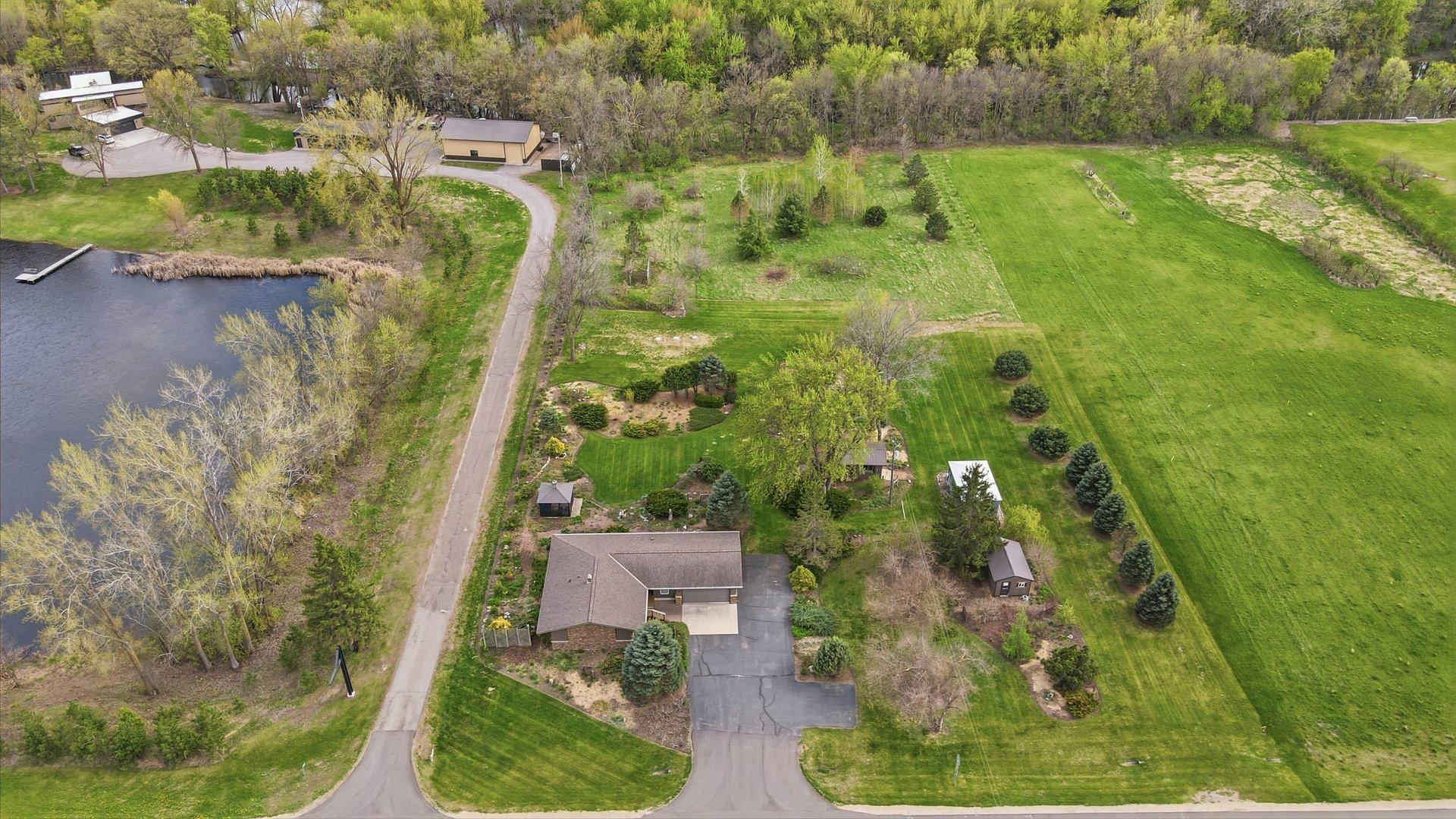 This property goes back to the far tree line and the evergreens to the west are on the property