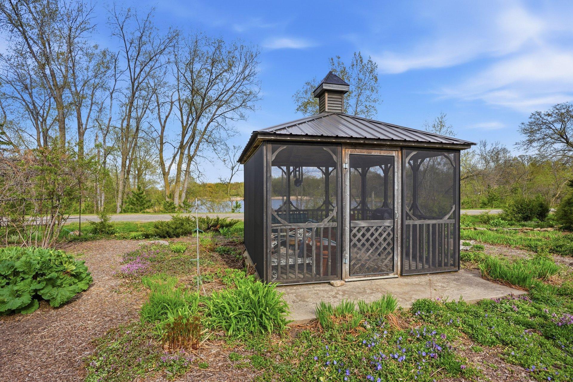 Screened Gazebo in the middle of the beautiful gardens