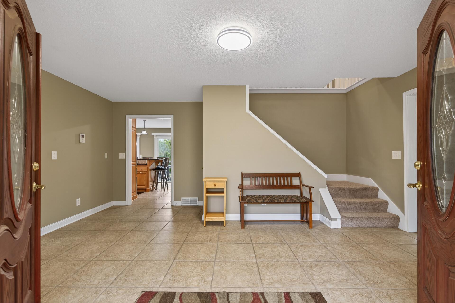 The Double french doors open to the large welcoming entry with 2 closests