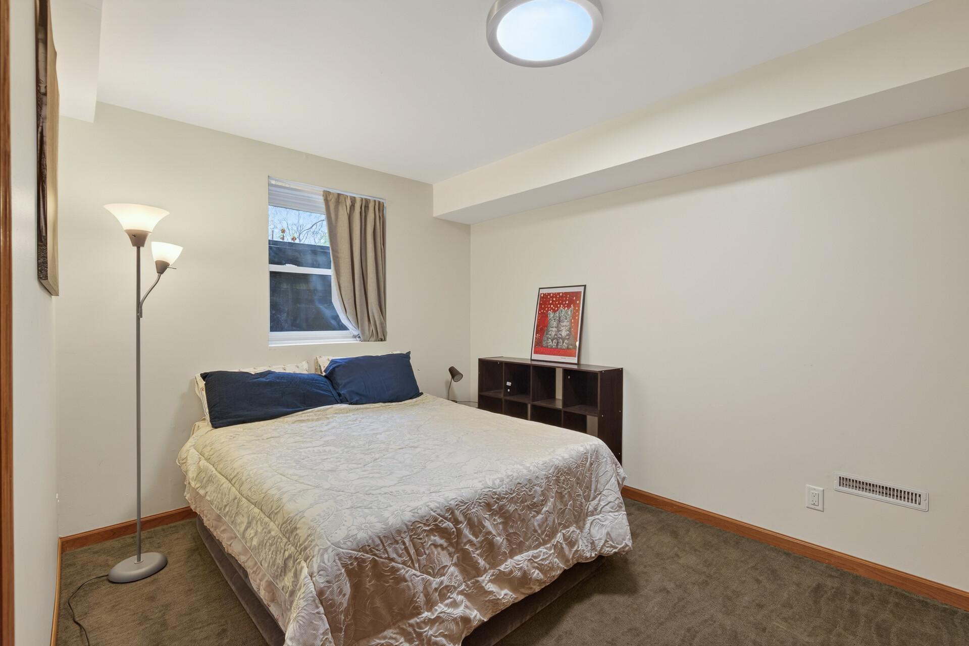 Nice sized lower level bedroom.