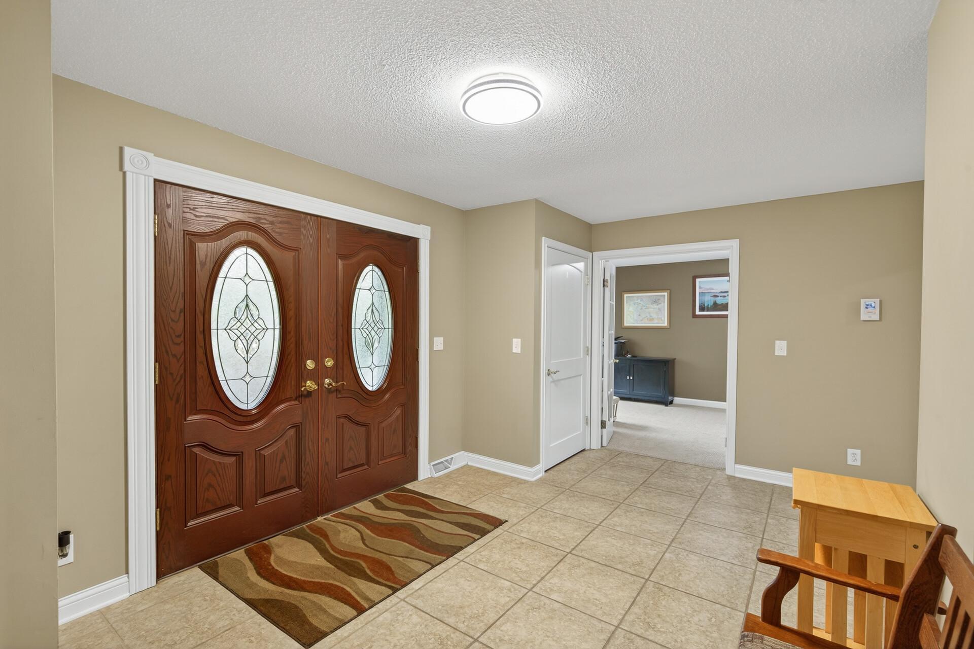 Large entry w/ tiled floors.