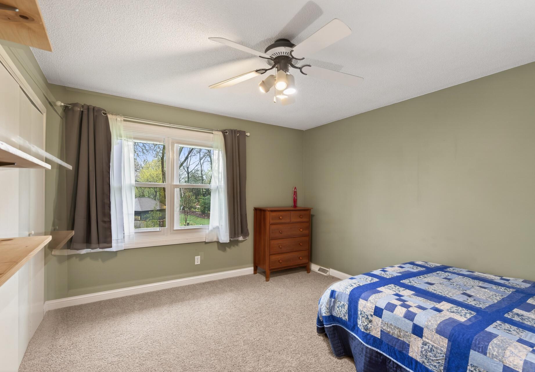 One of the 4 bedroom upstairs with nice views of the backyard.