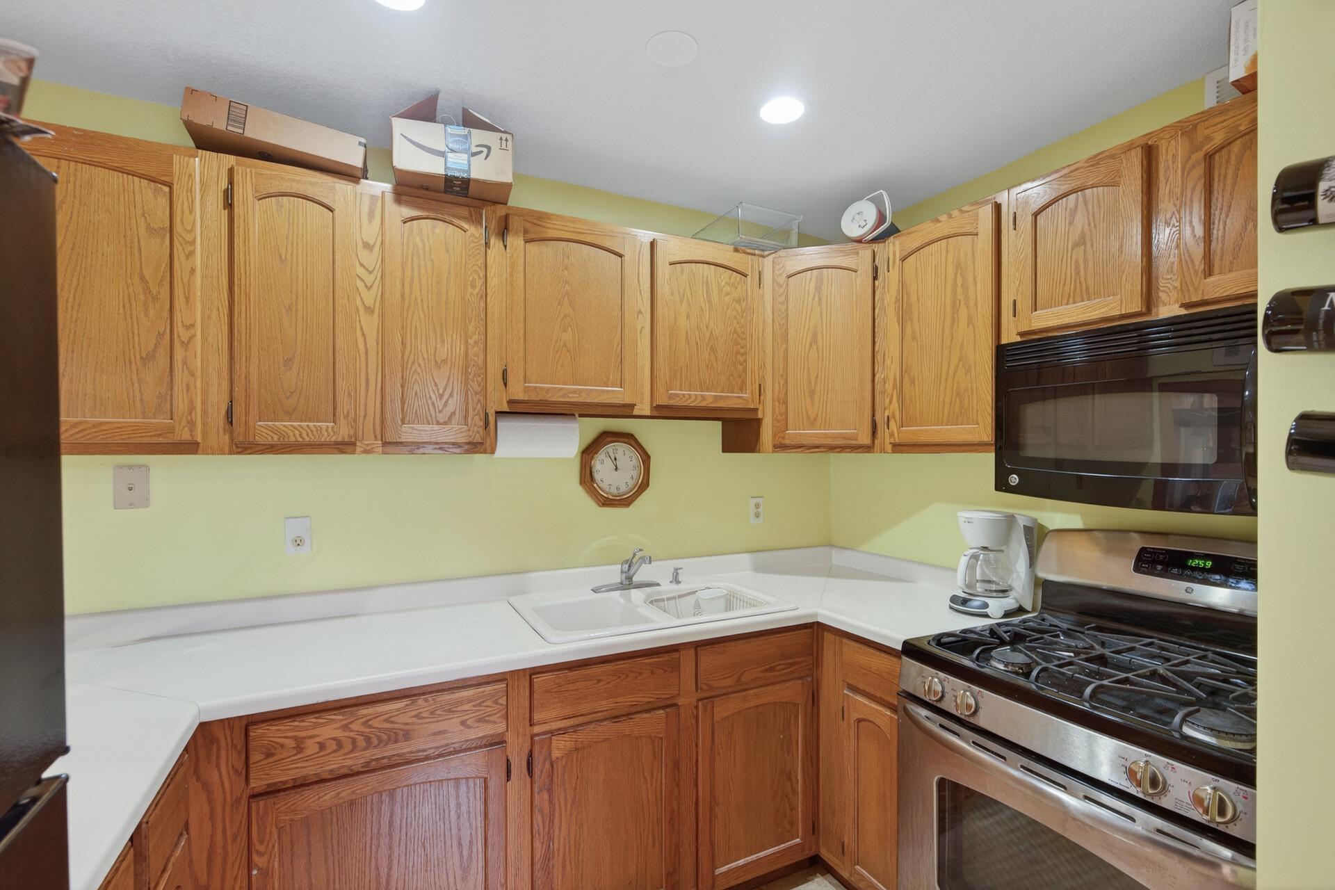 You'll love the lower level kitchen, complete with full refrigerator, gas range & microwave. Makes for a great in-law spot or perfect for the teenager