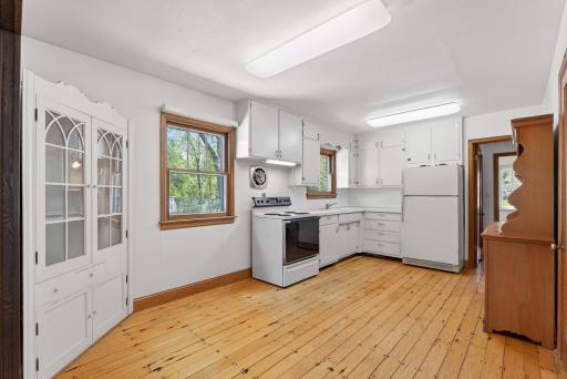 Natural hardwood flooring in the kitchen and living area.