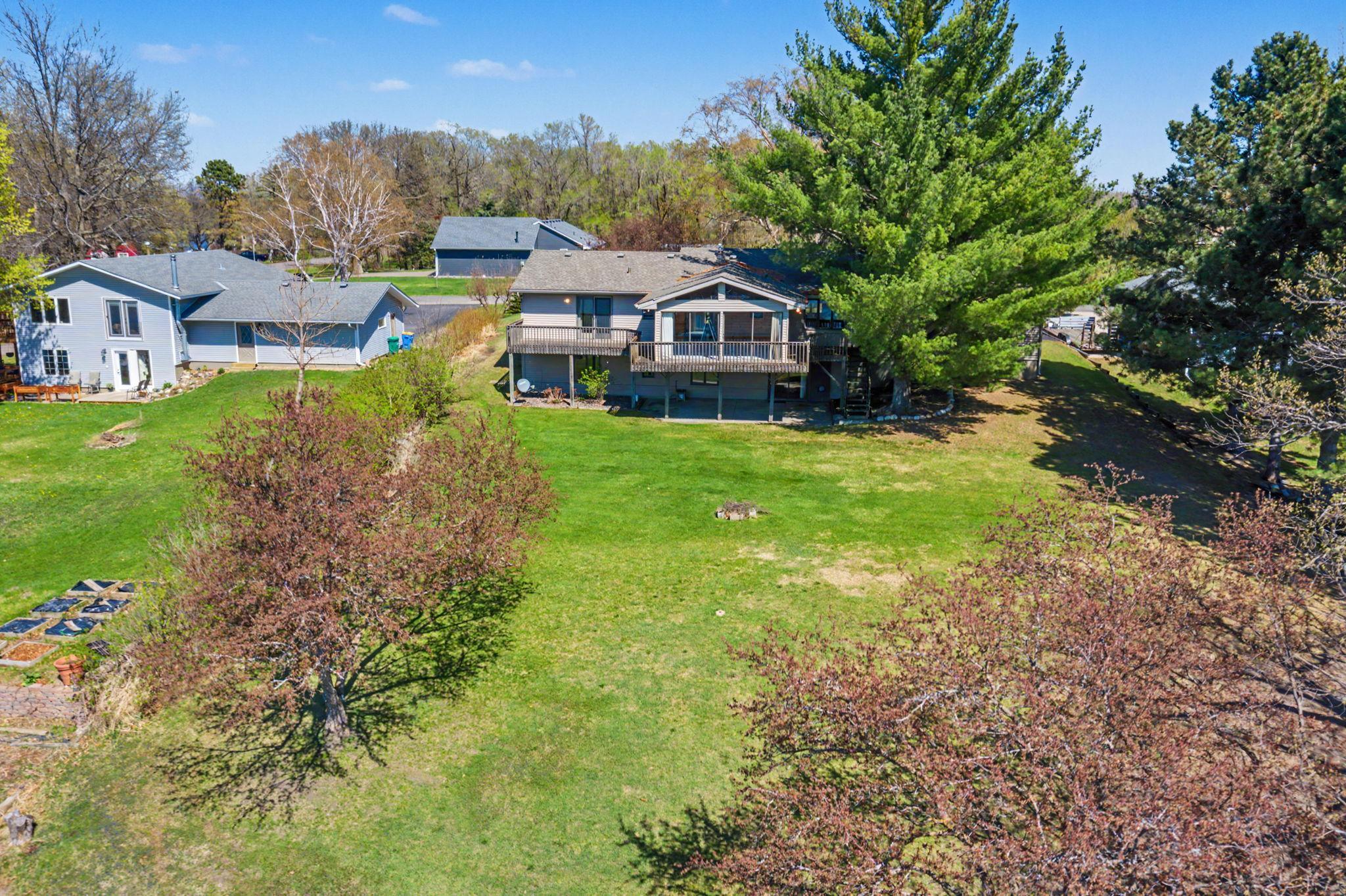 Unwind in the sunroom, where floor-to-ceiling windows frame breathtaking, elevated views of the lake.