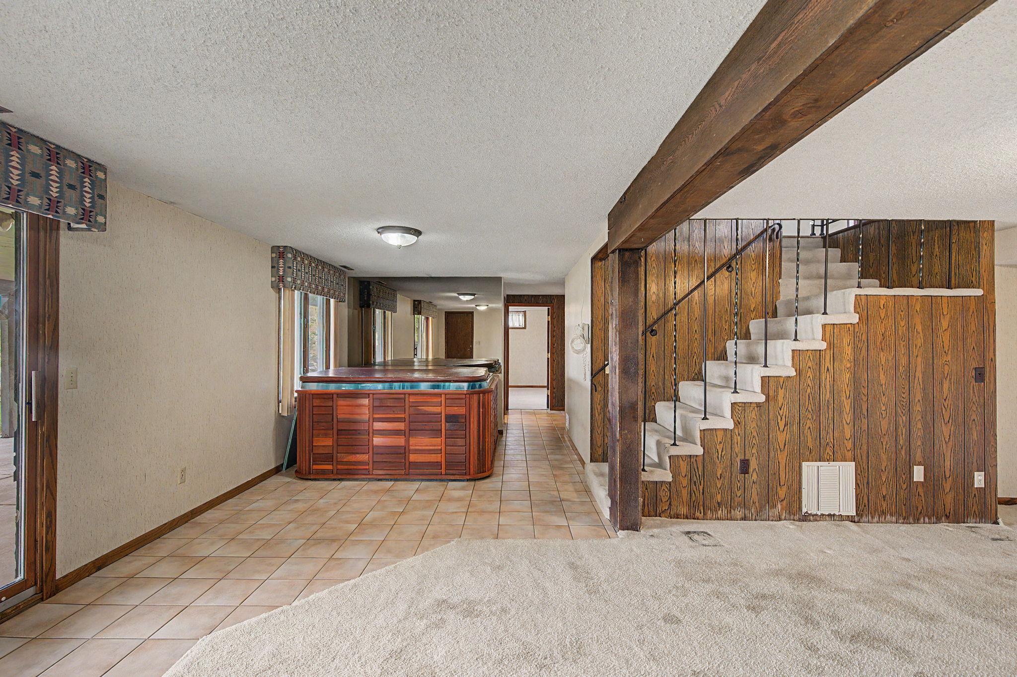 Lower level walk out with a hot tub. Sellers are unsure if it works.