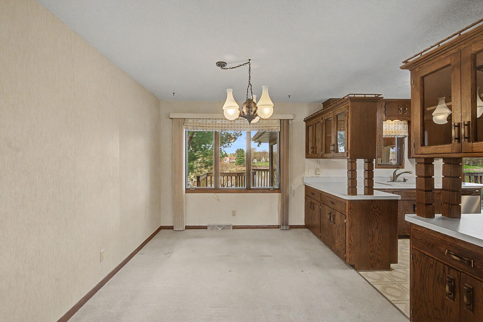 Living room opens up to the seperate dining space adjacent to the kitchen.