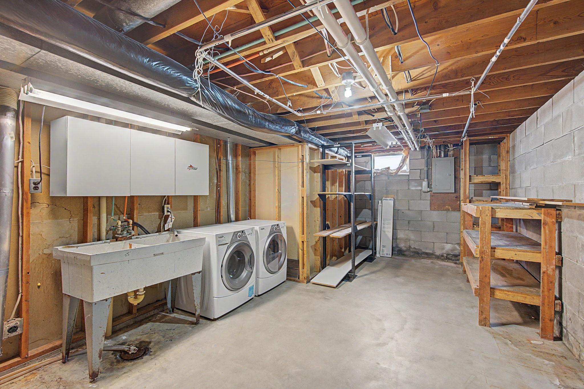Lower level utility room with LOTS of storage.