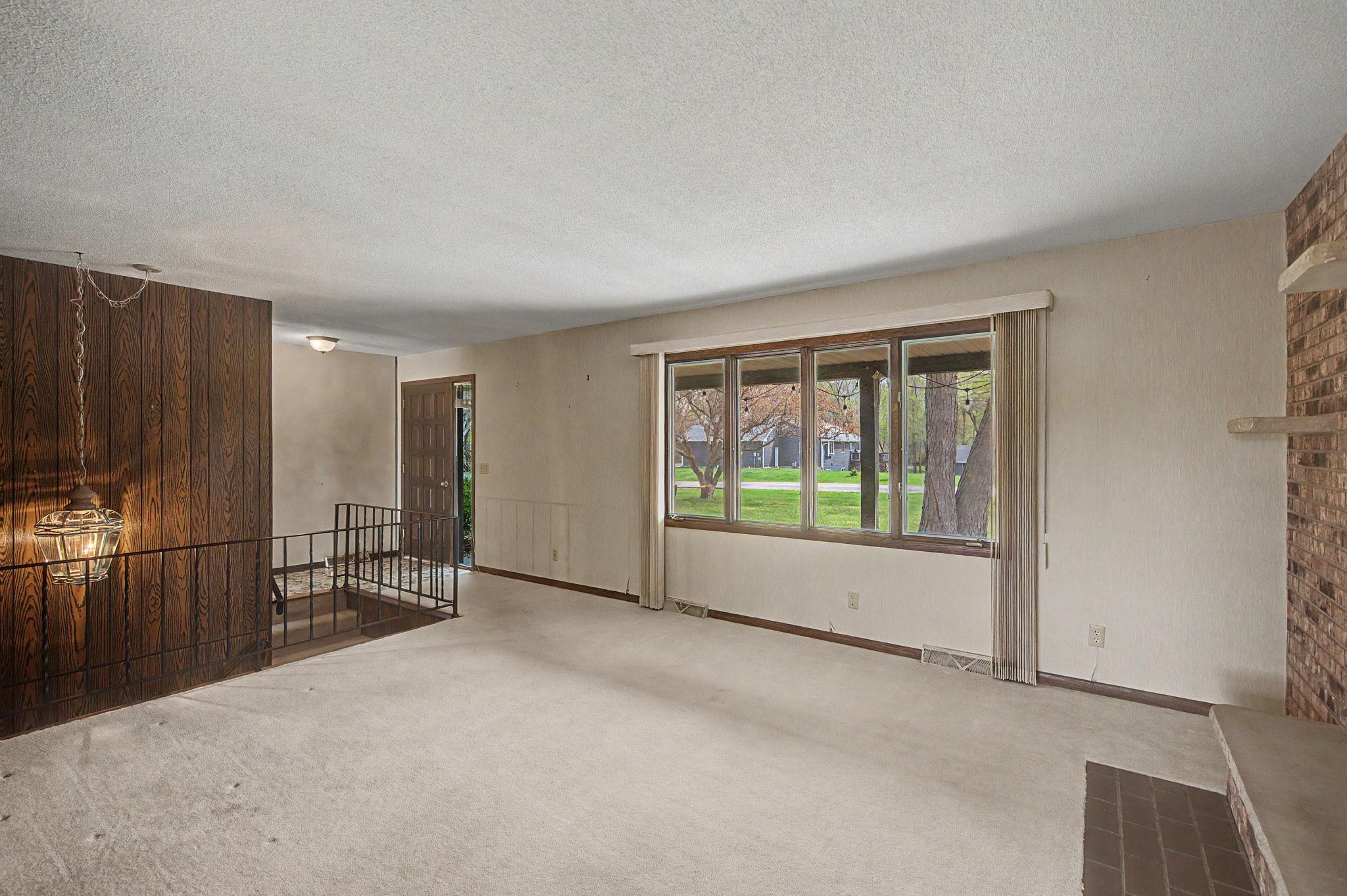 Enter through the front door into the living room.