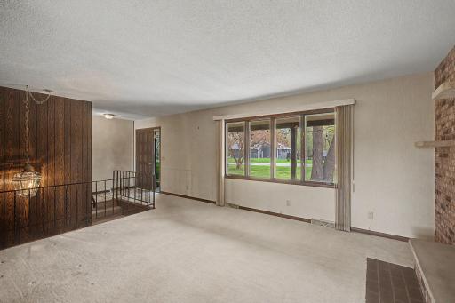 Enter through the front door into the living room.