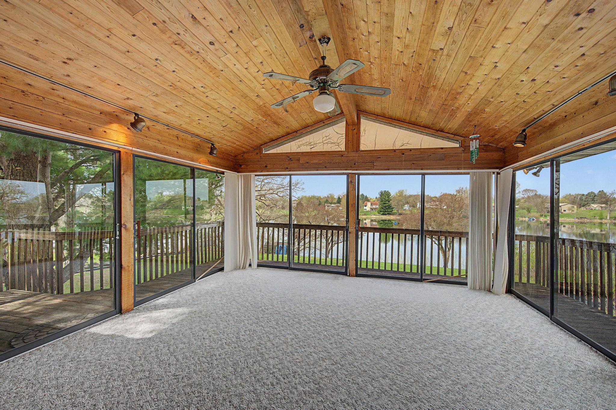 The sun room offers beautiful views of the lake.