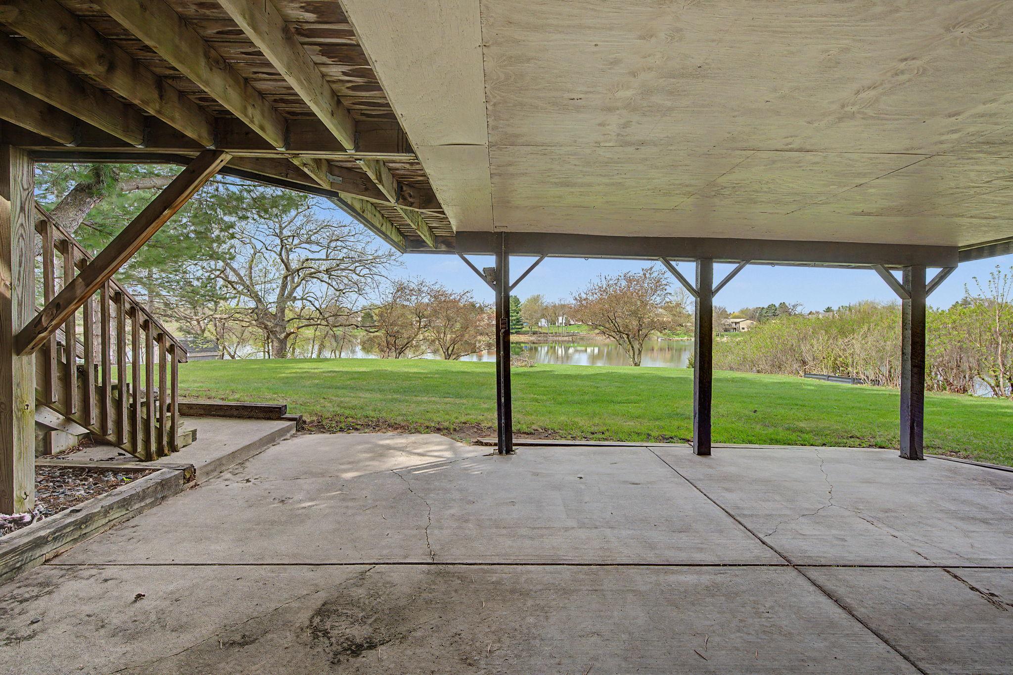 Lower level covered patio overlooking the lake. Enjoy the views even when it's raining.
