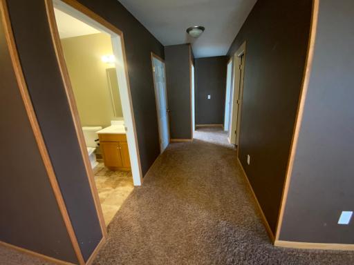 Wide hallway, bath, family room & 2 bedrooms in the lower level!b