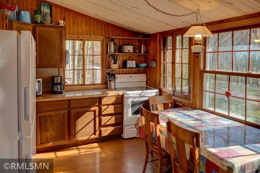 Kitchen and eat-in dining room as you enter the cabin.