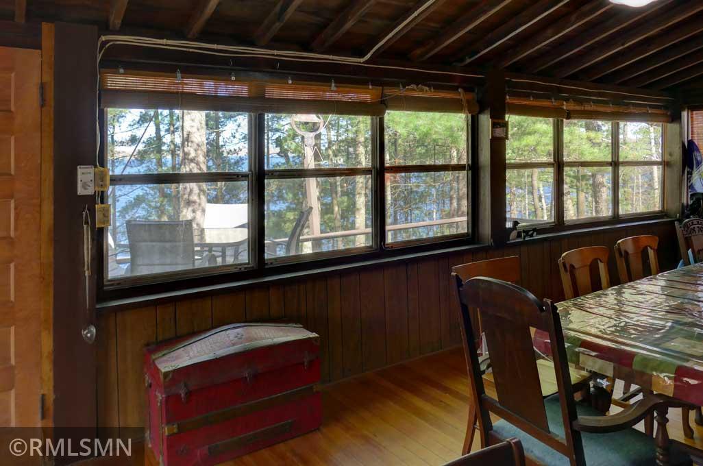 Three walls of windows overlooking the lake.