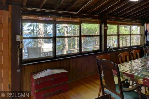 Three walls of windows overlooking the lake.