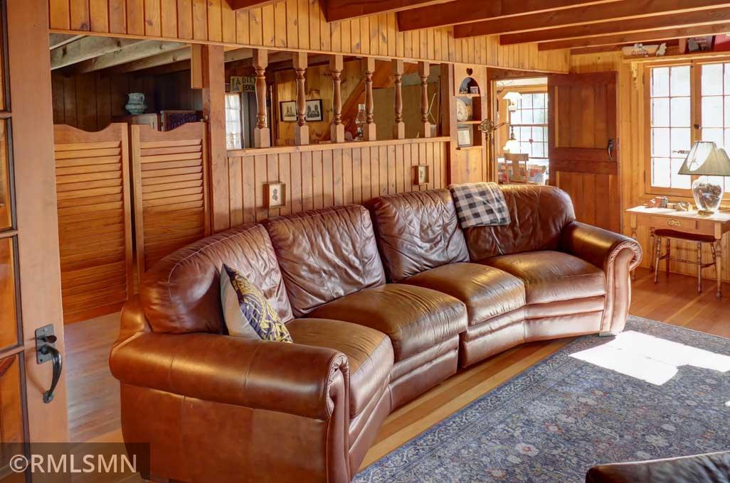 Back inside the cabin, one way to enter the main floor bedroom is through the saloon-style doors.
