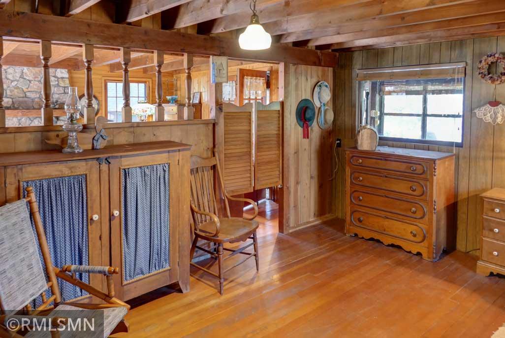 The main floor bedroom overlooks the living room as well.