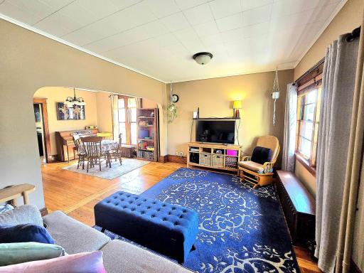Bright and open, sun-drenched rooms, with warm neutral paint, and original woodwork.