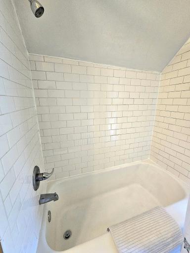 Beautiful subway tile surround and soaking tub with shower