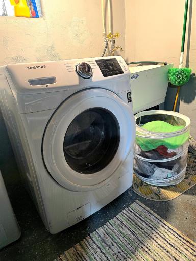Samsung front loading washer, utility sink, and dryer