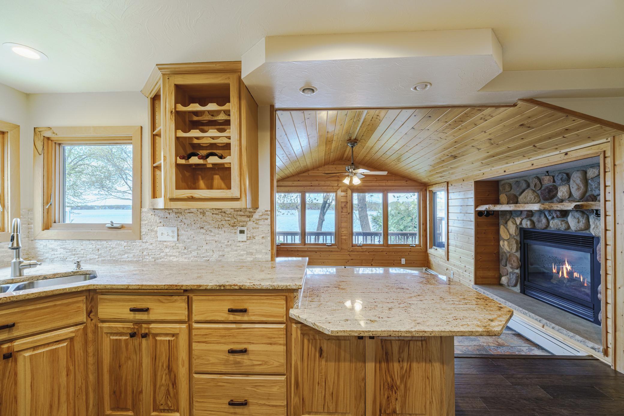 Deep drawers and a seating bar are additional features of the kitchen.