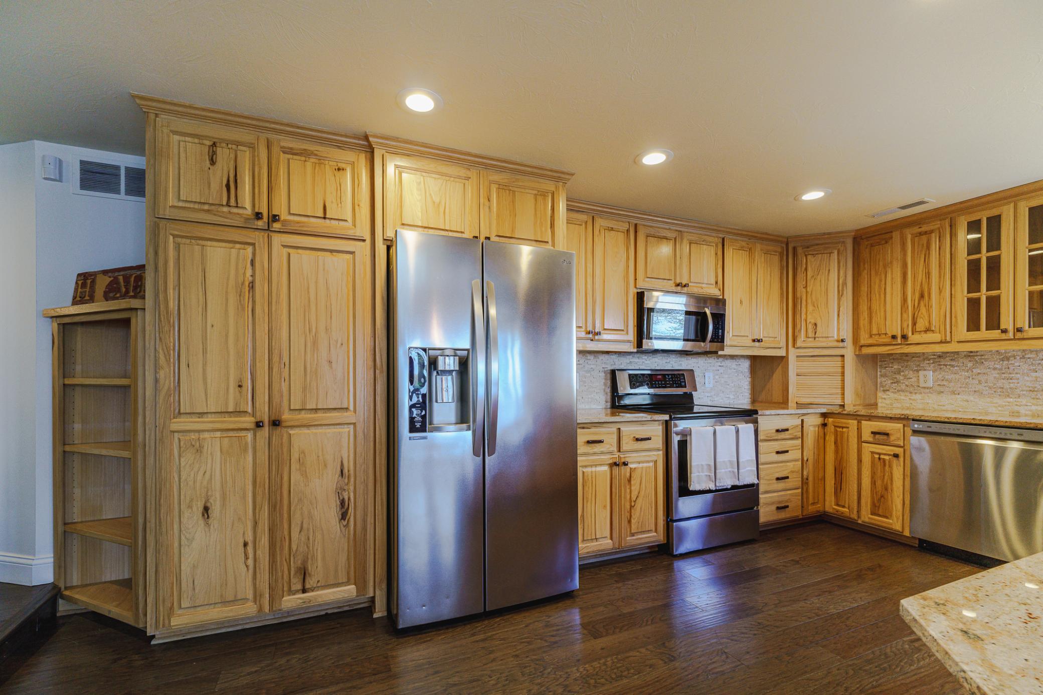The kitchen also has a backsplash and an appliance garage.