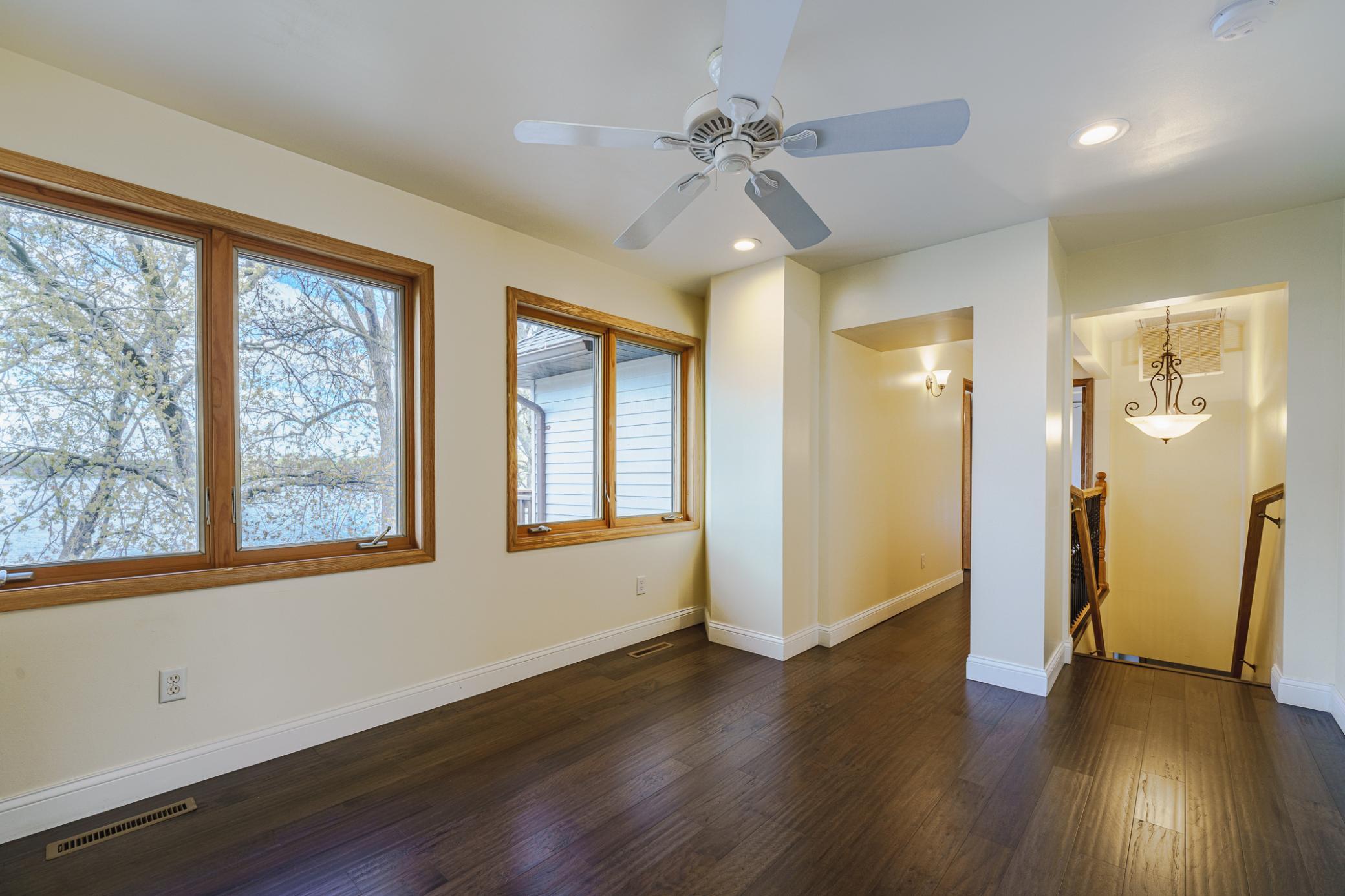 Two bedrooms lie right off the loft area. The other two are down this hall, and overlook the lake.