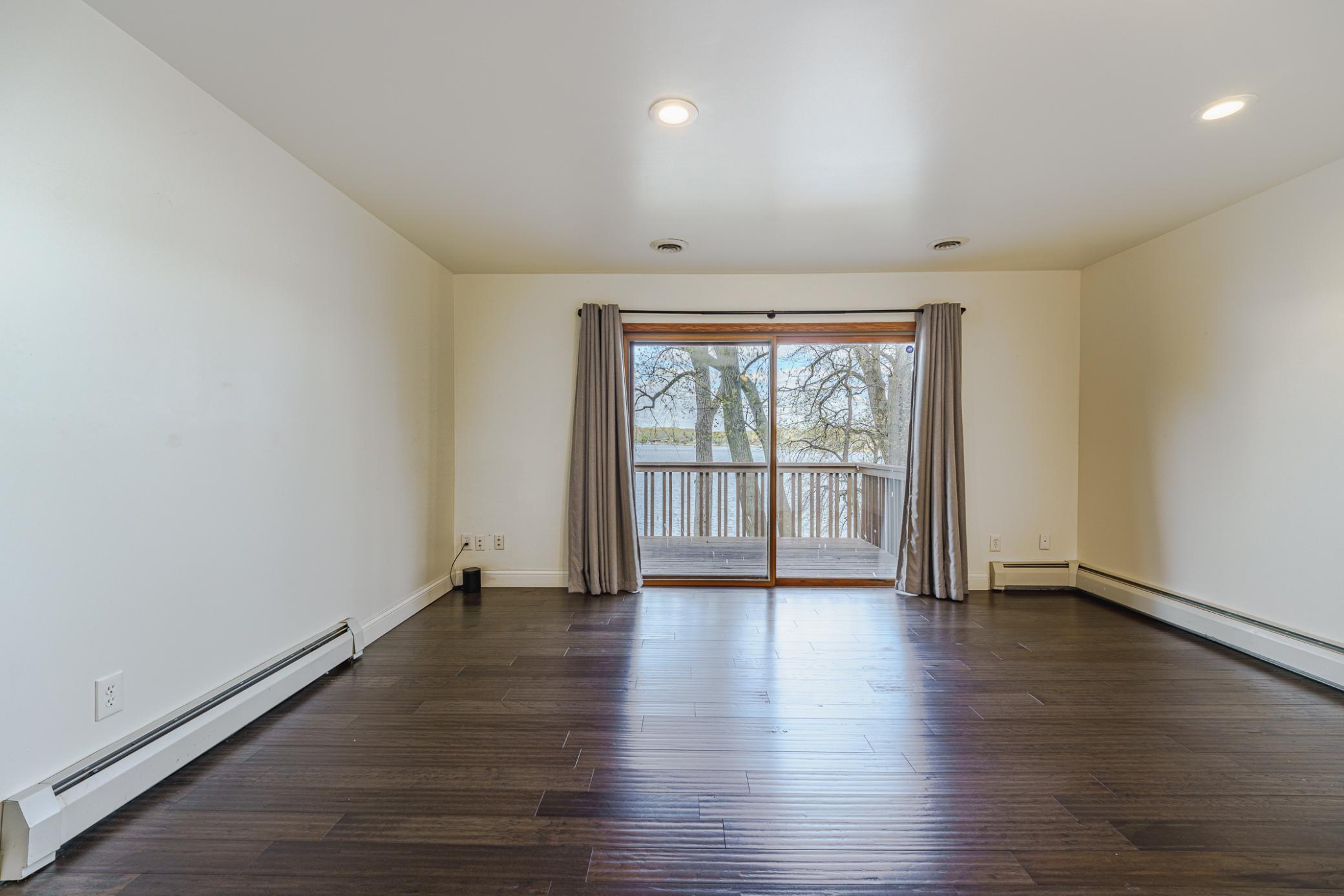 This patio door from the primary suite leads to the upper deck.