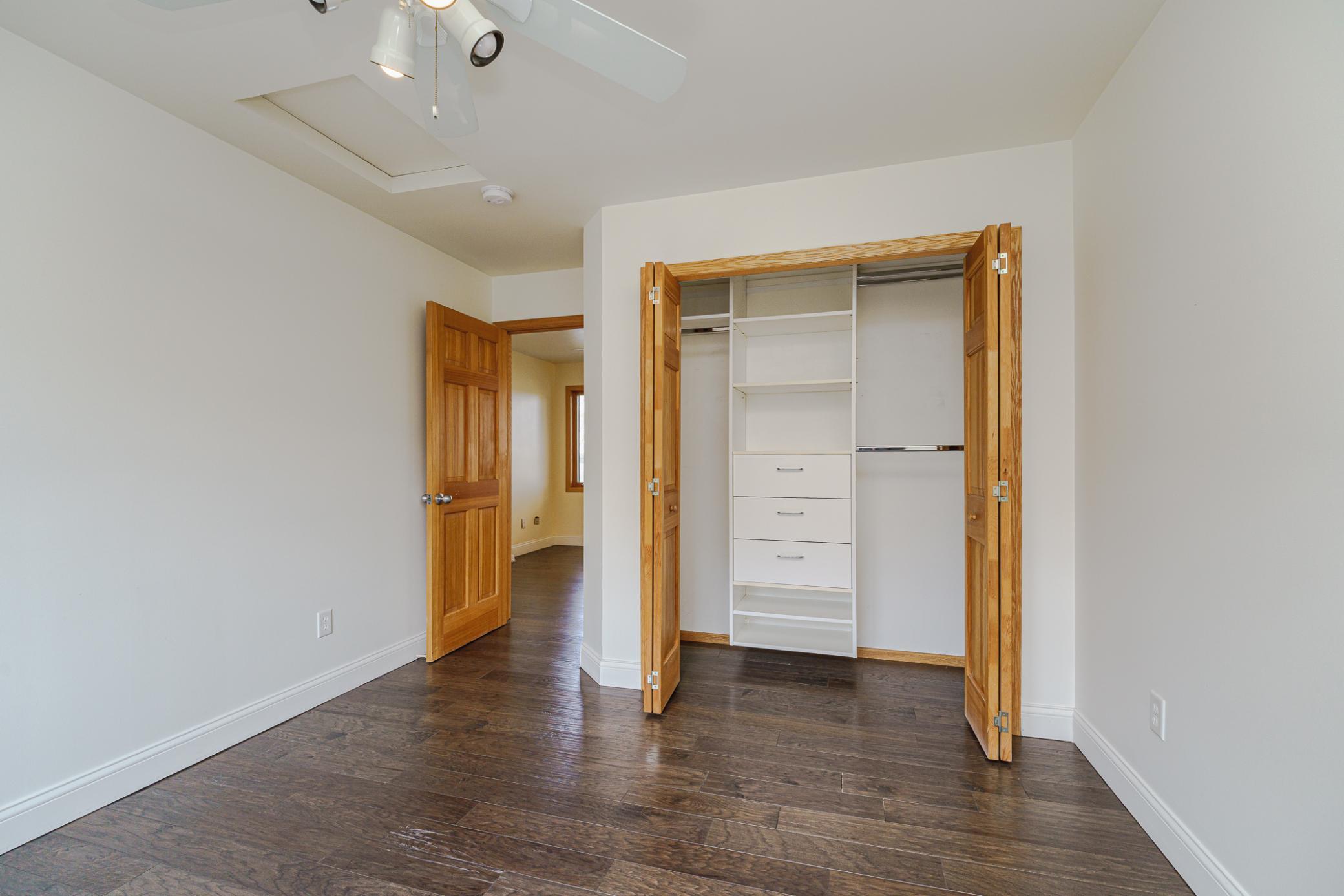 There are custom closet organizers in this room.