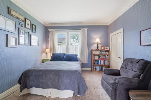 Main level bedroom #1 with french doors and walk-in closet.