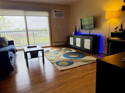Livingroom with room darkening shades and new wall-unit air conditioning!