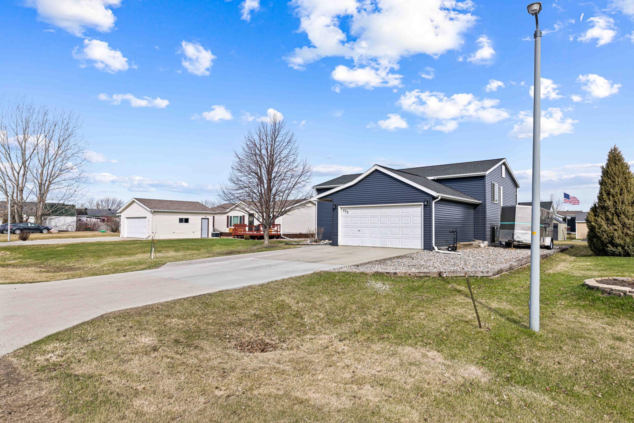 Extend gravel parking pad by garage