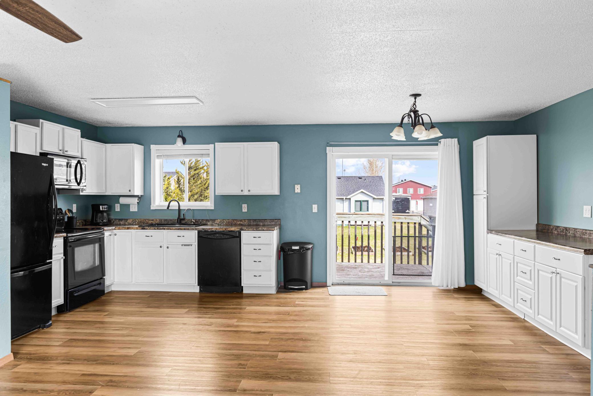 Kitchen, Dining with walkout to deck.