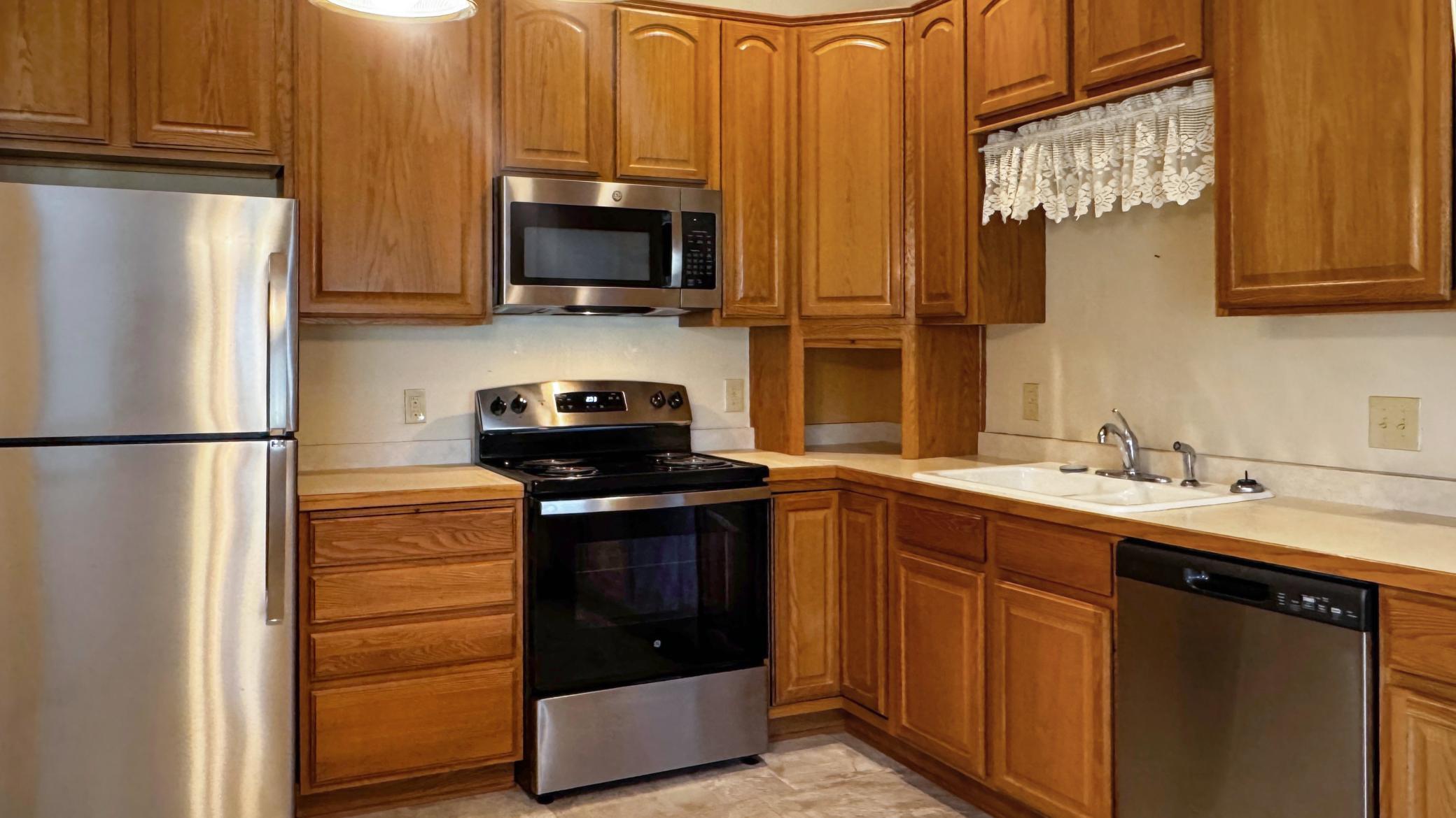 Enjoy ample cabinetry and stainless steel appliances