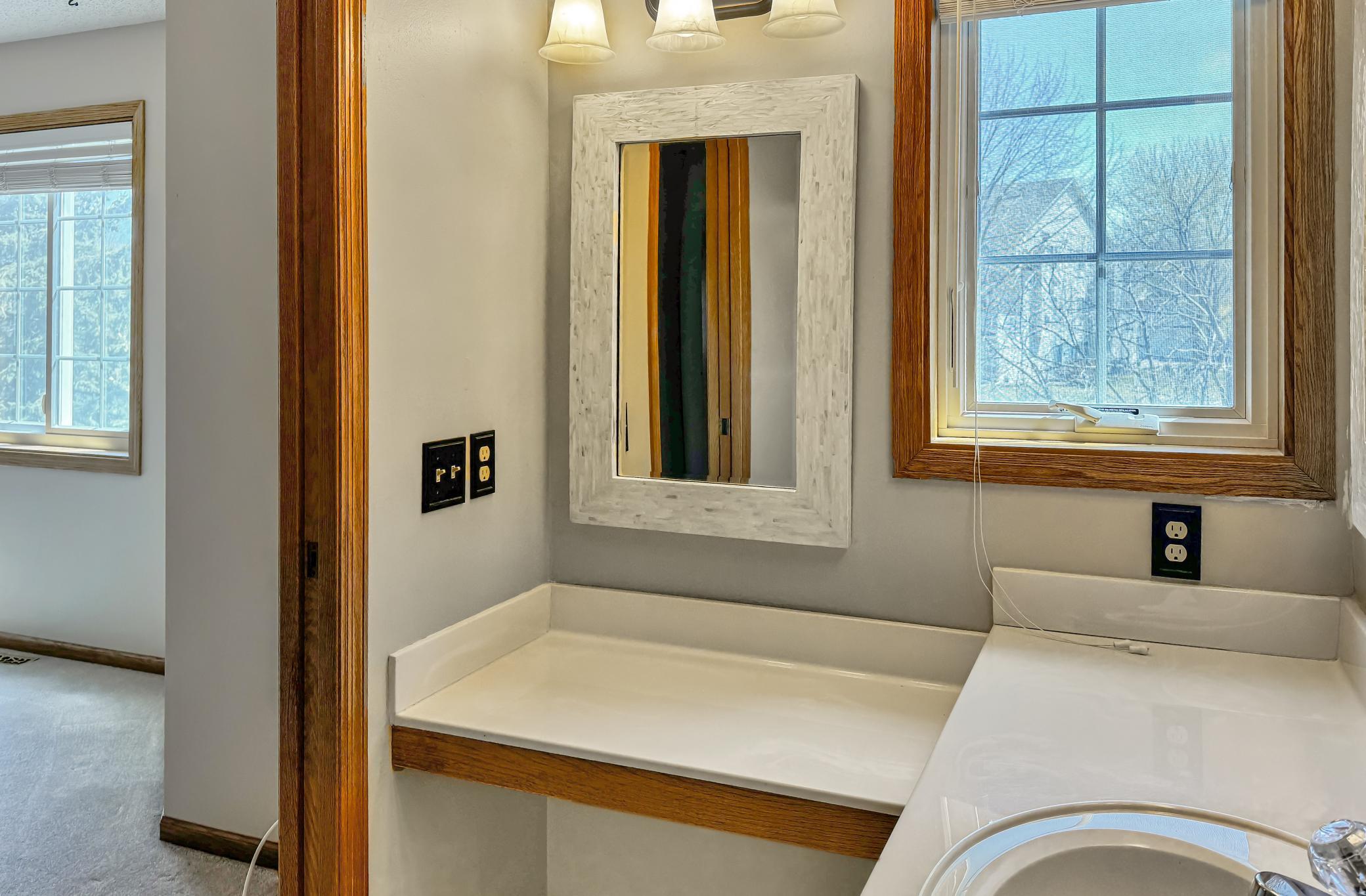 The primary bathroom also has a makeup vanity!