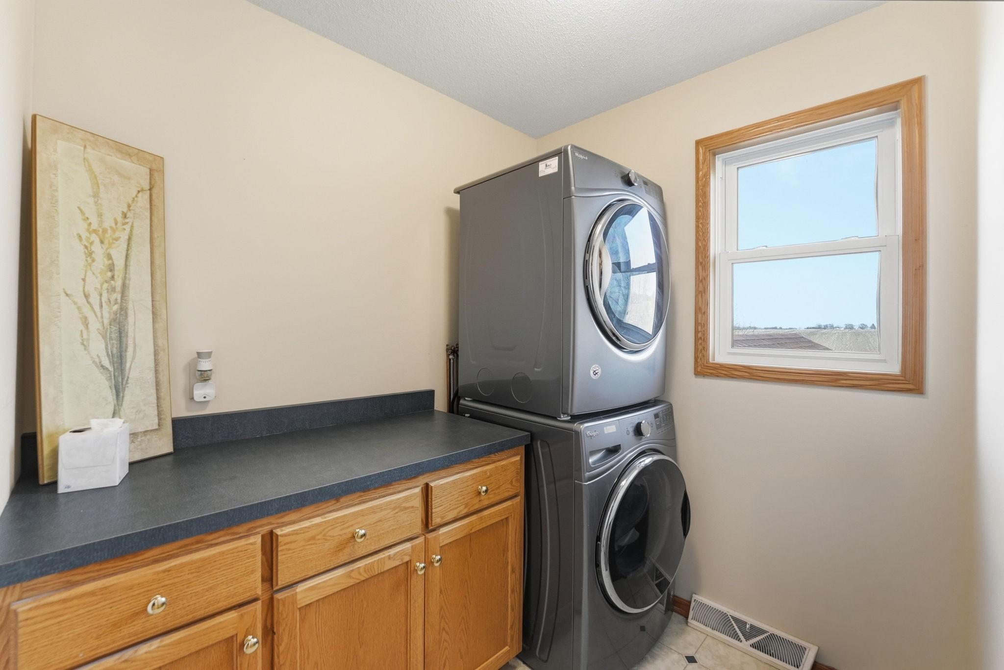 UL Laundry with Stackable Washer and Dryer! Lots of counter space for folding and storage