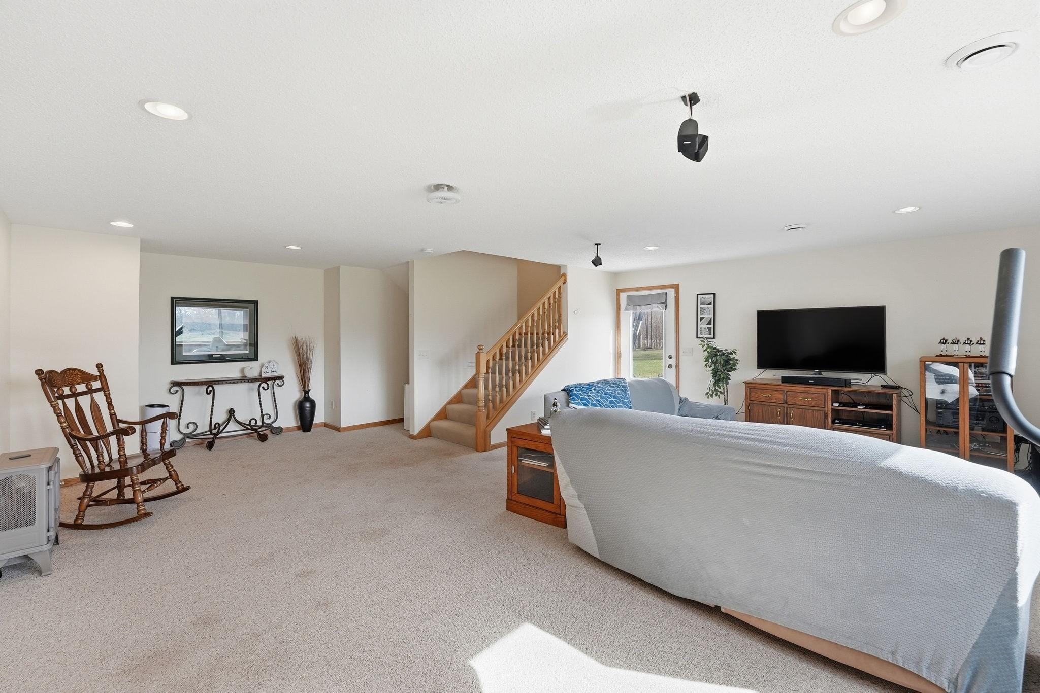 Large Open Family Room in the Lower Level. Walks out to large patio area.