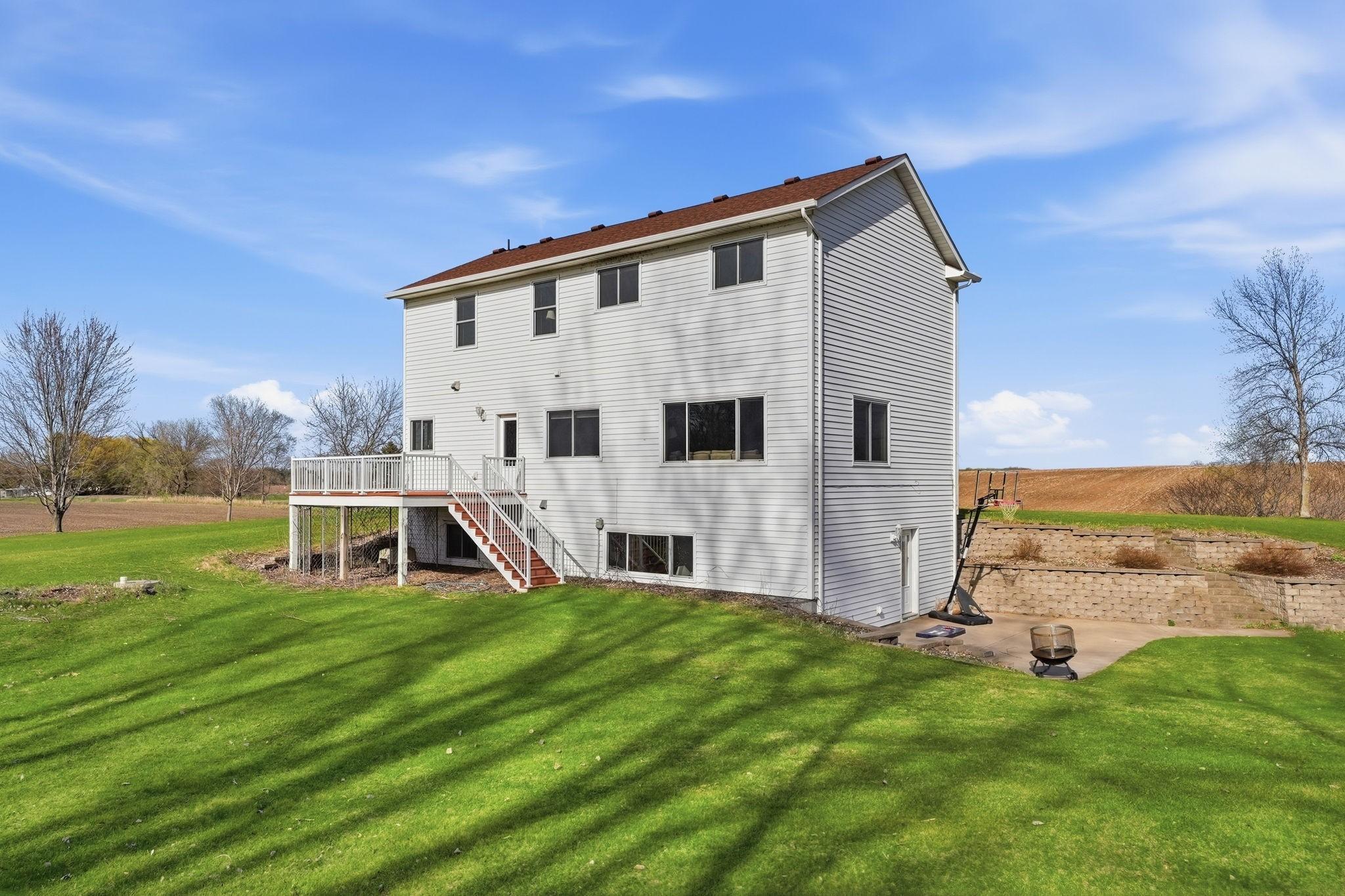 Back of home overlooking large private backyard!