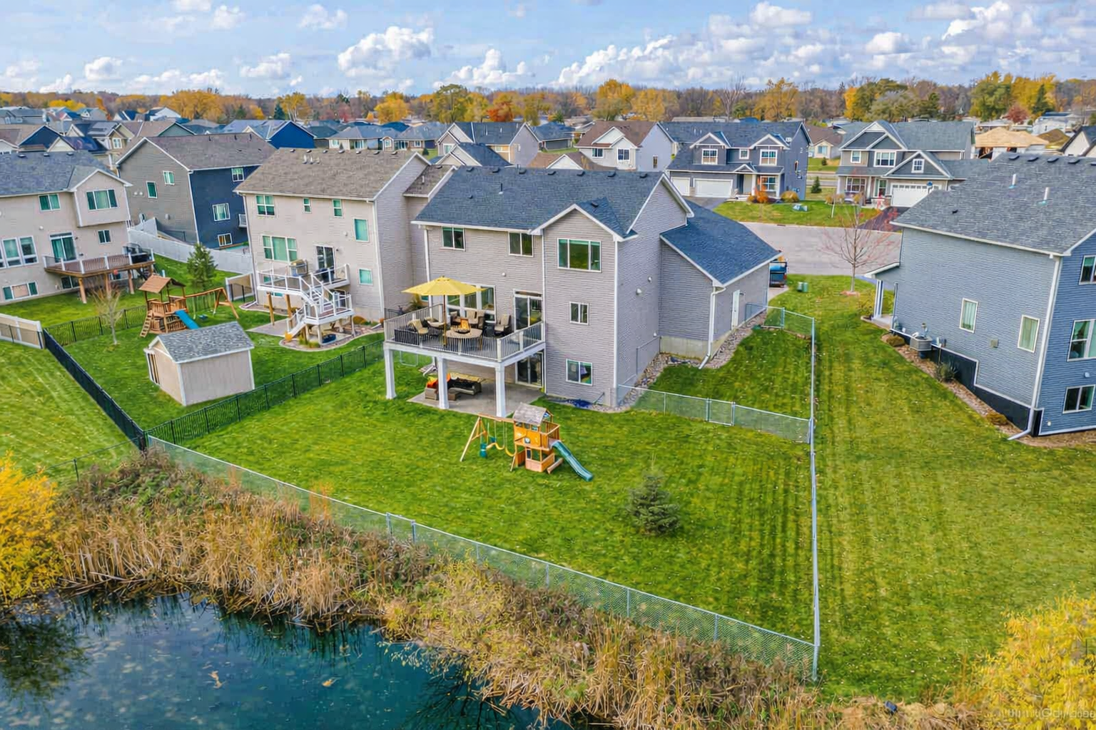 An ideal yard for enjoying the seasons and hosting gatherings, perfect for both kids and pets. Notice the separate fenced space ideal for pets to do their business.