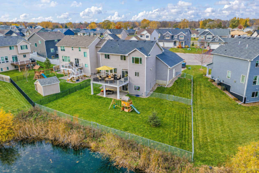 An ideal yard for enjoying the seasons and hosting gatherings, perfect for both kids and pets. Notice the separate fenced space ideal for pets. A sprinkler system makes yard maintenance easy.
