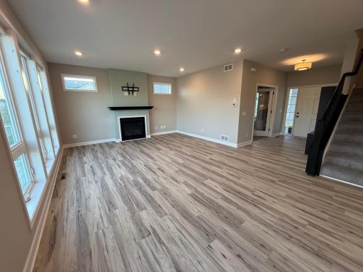 The main floor living room features floor-to-ceiling windows and faces south, making it bright and sunny all the time.