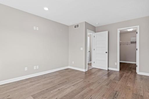 5th Bedroom in the lower level offers a huge walk in closet. The 3/4 bath is just step form the entrance. The walkout lower level living space is ideal for muti generational living, teens or guests.